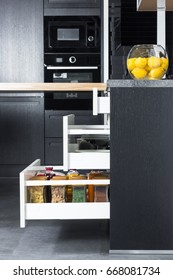 Side View Of A Spices And Groceries Organized In A Modern Kitchen Drawer. Kitchen Design Inspiration. 