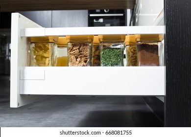 Side View Of A Spices And Groceries Organized In A Modern Kitchen Drawer. Kitchen Design Inspiration. 