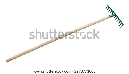 side view of steel rake with tines downwards with wooden handle isolated on white background