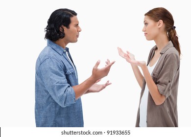 Side View Of Talking Couple Against A White Background