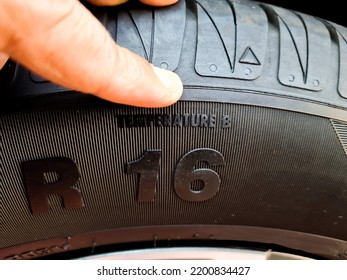 Side view of the tire with the indication of the width of the tire, the height and diameter of the wheel. tire code that includes the temperature code, speed limit and expiration date of the tire and