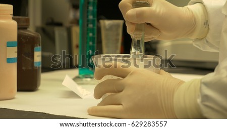 Side view of titration in a compounding pharmacy