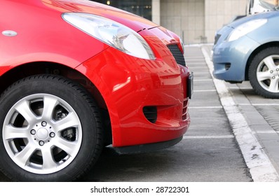 Side View Of The Two New Cars Standing On The Parking Lot