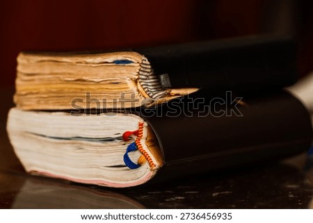 Side View of Two Stacked Vintage Books with Aged Yellowed Pages and Fabric Ribbon Bookmarks, Antique Hardcover Literature Texture for Historical Research, Academic Wisdom and Education Concept