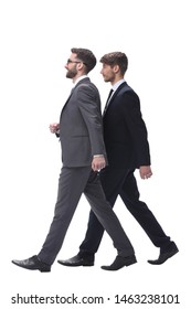 Side View. Two Young Businessmen Stepping Forward.