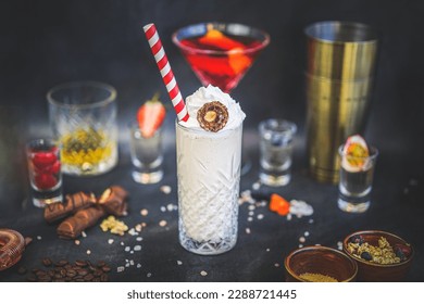 Side View of Vanilla Milkshake with Ferrero Rocher Garnish: Creamy Beverage, Chocolate Decadence, Gourmet Treat, Delicious Indulgence, Sweet Temptation, Rich Flavors - Powered by Shutterstock