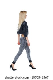 side view of walking woman. beautiful girl in motion. backside view of person.  Rear view people collection. Isolated over white. Blonde in a leather jacket goes past the frame - Shutterstock ID 1070546567