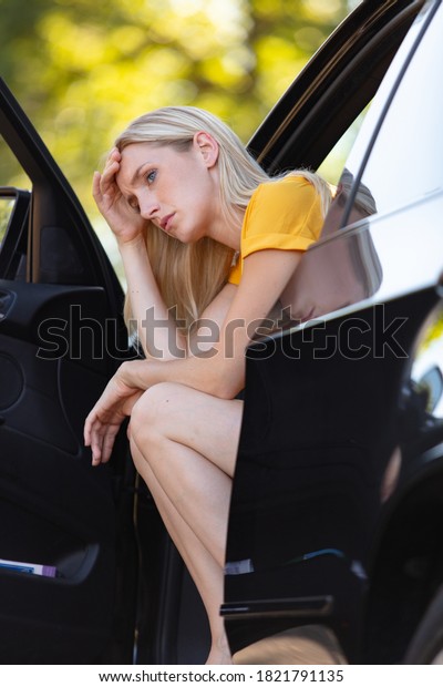 side view window portrait displeased young\
stressed driver