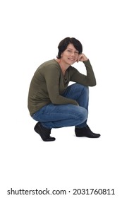 Side View Of A Woman Crouching And Hand On Face On White Background