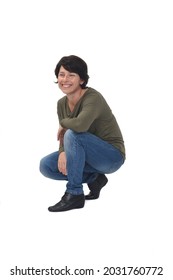 Side View Of A Woman Crouching And Looking Away On White Background