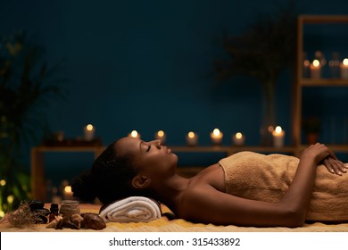 Side View Of Woman Having Aromatherapy Treatment In Spa Salon