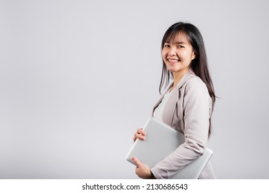 Side View Woman Smiling Confident Smiling Holding Closed Laptop, Portrait Excited Happy Asian Young Female Person Hugging Close Cover Computer Device Studio Shot Isolated On White Background