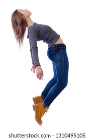 Side View Of Woman In Zero Gravity Or A Fall. Girl Is Flying, Falling Or Floating In The Air. Side View People Collection.  Isolated Over White Background. The Girl In Jeans Teetering On Her Toes.