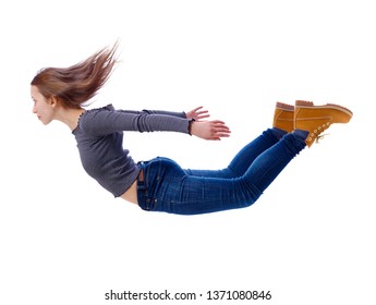 Side View Of Woman In Zero Gravity Or A Fall. Girl Is Flying, Falling Or Floating In The Air.  Side View Of Person. Isolated Over White Background. Girl Flies Down Jumping From A Helicopter.