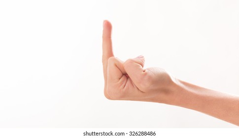 Side View Of Woman's Middle Finger Over White Background. Woman Showing Her Aggressiveness And Discontent.