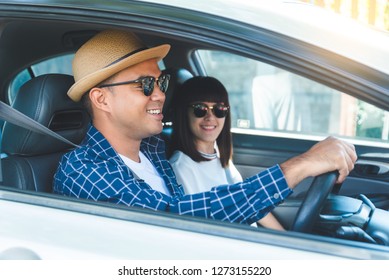 Side view young asian couple happiness and smiling sitting in car. Travel concept, Safety first insurance concept
 - Shutterstock ID 1273155220