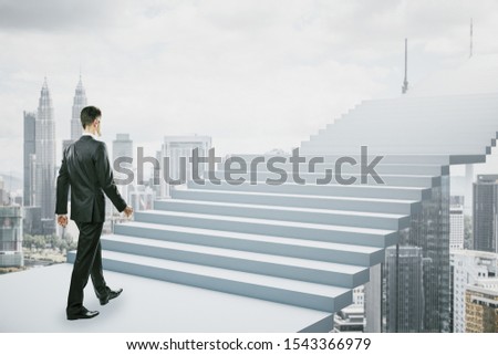 Side view of young businessman climbing abstract stairs on bright Kuala Lumpur city background. Career development and ascend concept 