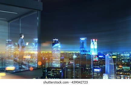 Side View Of Young Businessman With Coffee Cup In Hand Standing On Panoramic Balcony With Singapore City View At Night. 3D Rendering