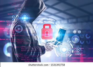 Side view of young hacker in black hoodie using laptop over blurry office background with double exposure of HUD cybersecurity interface. Toned image