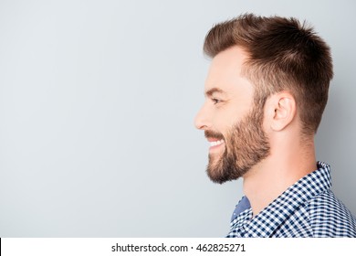 Side view of young happy smiling bearded man - Powered by Shutterstock
