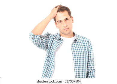 Side View Of Young Man With Headache Touching Forehead On White Background. Student Failed The Exam. Copy Space And Mock Up. Fashion 