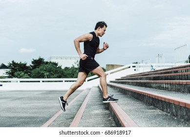 Side View Of Young Sport Man Running