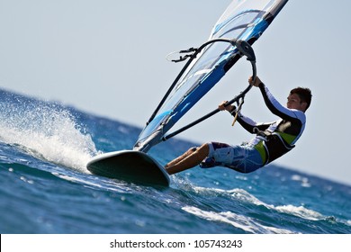 Side view of young windsurfer close-up