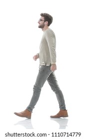 Side View.Young Smiling Man Walking Forward