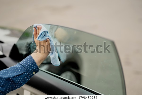 the side window of the car drying after\
wash, a special\
professional