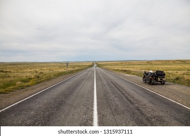 A Sidecar Motorcycle On An Empty Stretch Of Road.