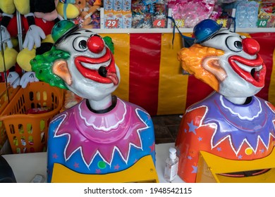 Sideshow game put the ball in the rotating clown's mouth and win a prize at a country show