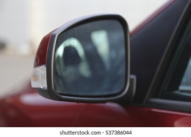 Sideview Mirror In The Red Car