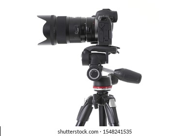 Side-view of professional camera device with big camera glass isolated