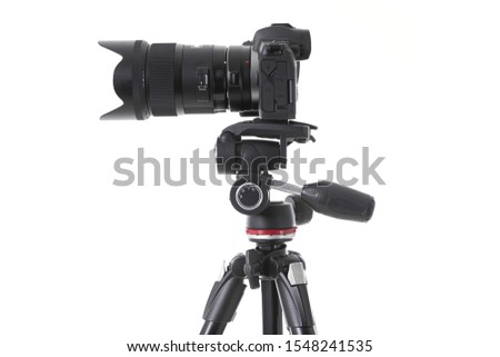 Side-view of professional camera device with big camera glass isolated