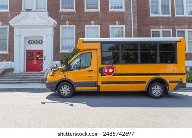 Sideview of School Van in Front of Elementary school