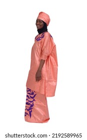 Sideview Of A Woman With African Traditional Costume And Looking At Camera On White Background