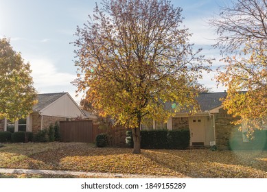 Sidewalk Along Neighborhood Street With Pile Of Fallen Leaves In Suburban Area Near Dallas, Texas, America.