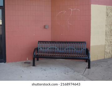 Sidewalk Bench Outside An Abandoned Mall