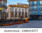 Sidewalk cafe in the city center of Porto with colorful buildings with nobody. Medieval architecture with empty restaurant of Oporto downtown, Portugal at sunrise. Travel destination