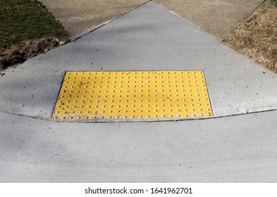 Sidewalk Curb Ramp With Bumpy Anti Slip Pad.