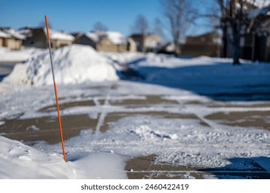 Sidewalk with edge markers used for snow blowing guides - Powered by Shutterstock