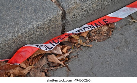 Sidewalk And French Police Tape With Leaves