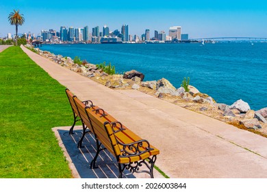 A sidewalk lines the waterfront of San Diego and beckons you to sit on a bench and look at the skyline and Coronado Bay Bridge.