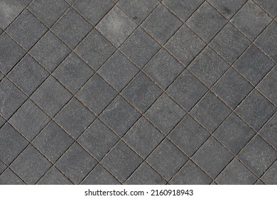 Sidewalk of square paving stones seen from above - Powered by Shutterstock