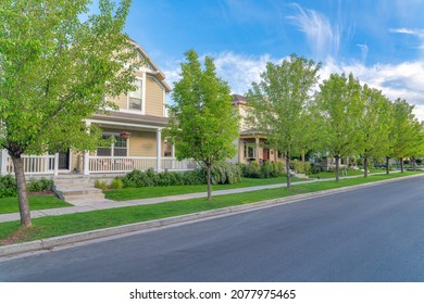Sidewalks outside the residential area with columnar trees at Daybreak, Utah