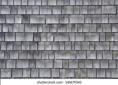 Siding of gray wood shingles with low environmental impact on house in Cape Cod, Massachusetts