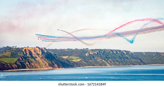 Sidmouth/UK -  August 25 2017: The Royal Air Force (RAF) Red Arrows Team Perform With Their BAE Hawk Aircraft At One Of Their Aerial Displays In The UK