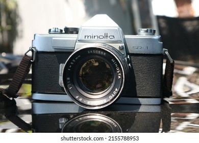 SIDOARJO, INDONESIA - May 05, 2022: Minolta SR-1 with MC Rokkor-PF 1:1.4 f=58mm vintage 35mm analog film camera, launched in 1966.