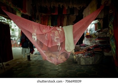Siem Reap Cambodia - 26 APR 2016: Baby hanging inside the cloth, lifstyle in Siem Reap, Cambodia