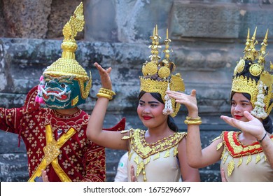 SIEM REAP, CAMBODIA - FEB 12 2020: Cambodian tradition dancers in front of Angkor Wat. The Apsara dance is a traditional dance of Cambodia. UNESCO World Heritage Site.